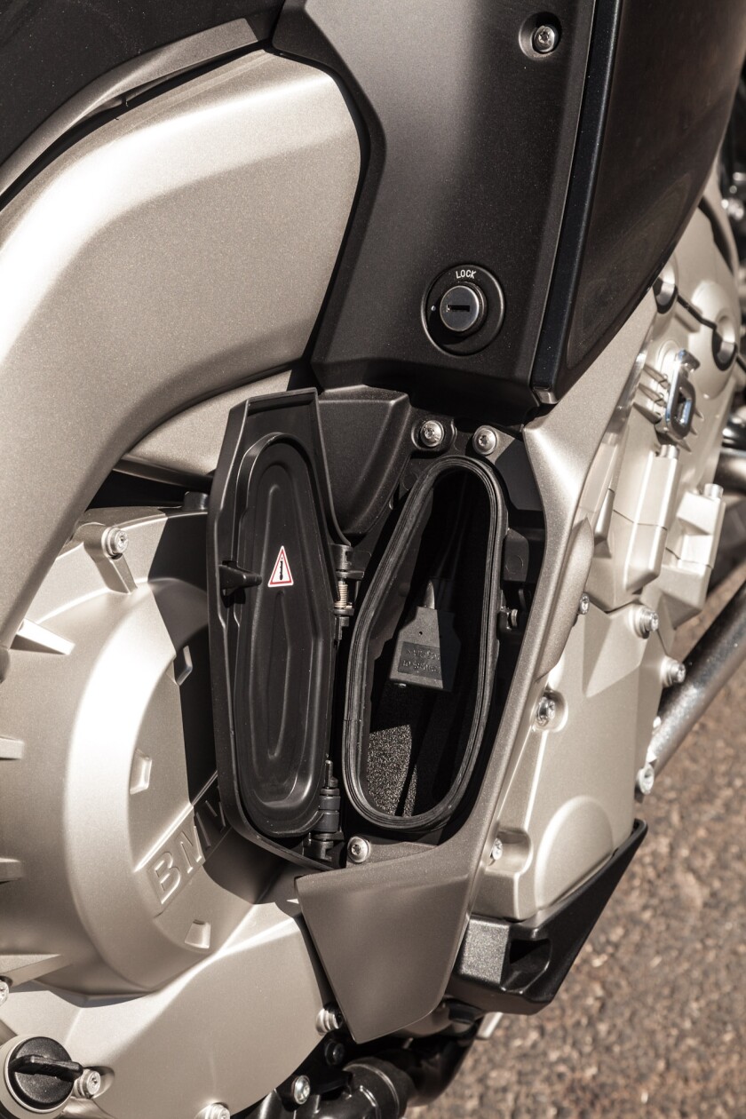 The BMW K1600GTL - inbuilt lockable phone compartment with USB charger that interfaces with the bike's stereo system (Photo: Loz Blain)