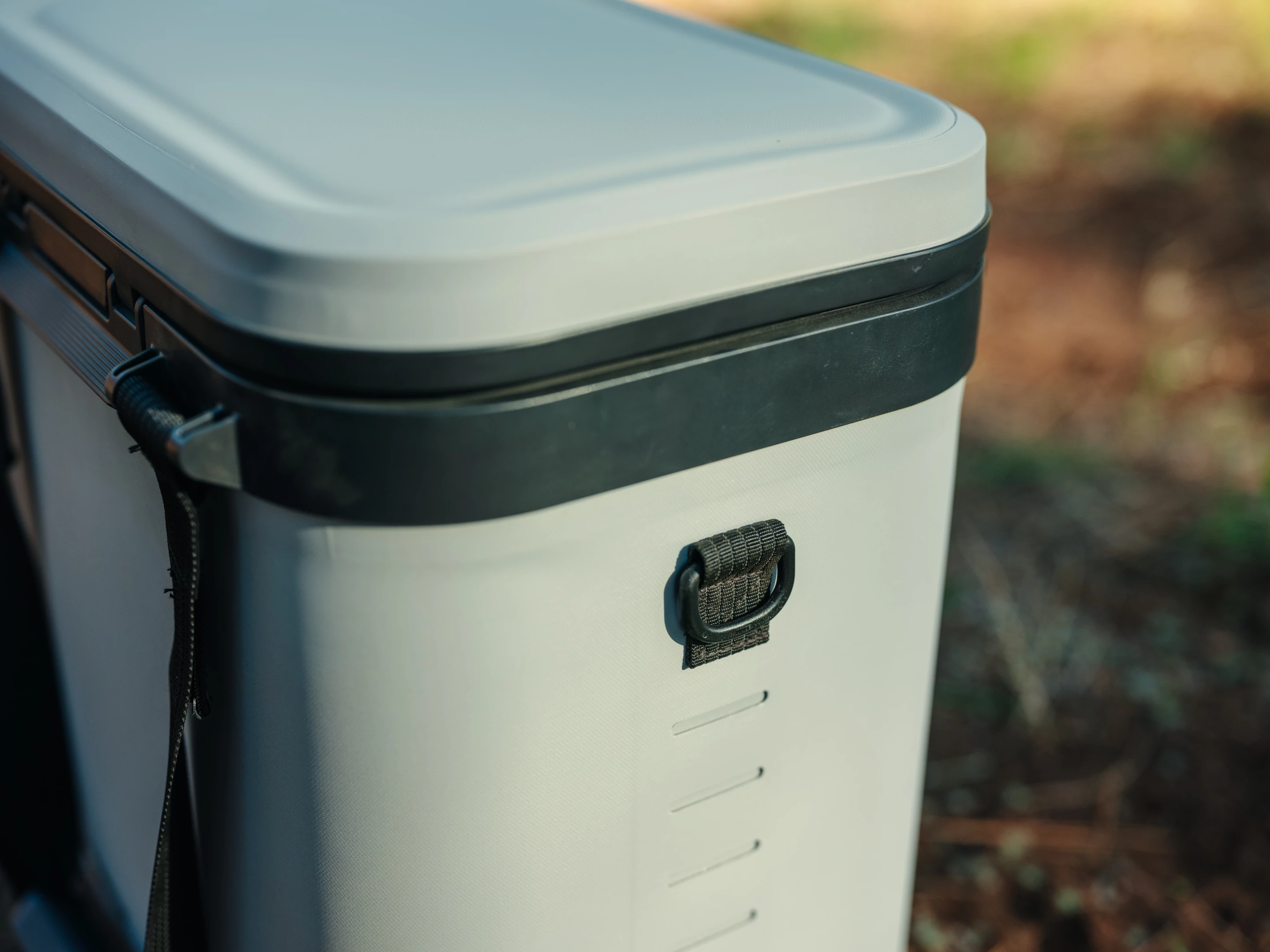 Soft coolers coe with tie-down loops and MOLLE-style sides for attachments