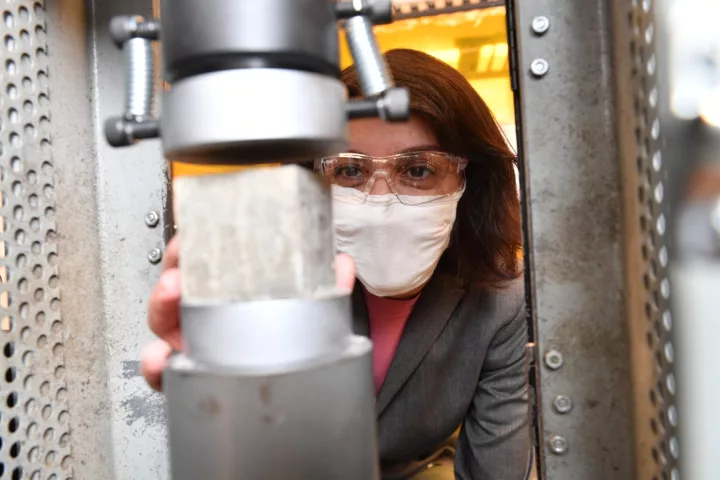 Assoc. Prof. Somayeh Nassiri tests a block of chitin-boosted cement