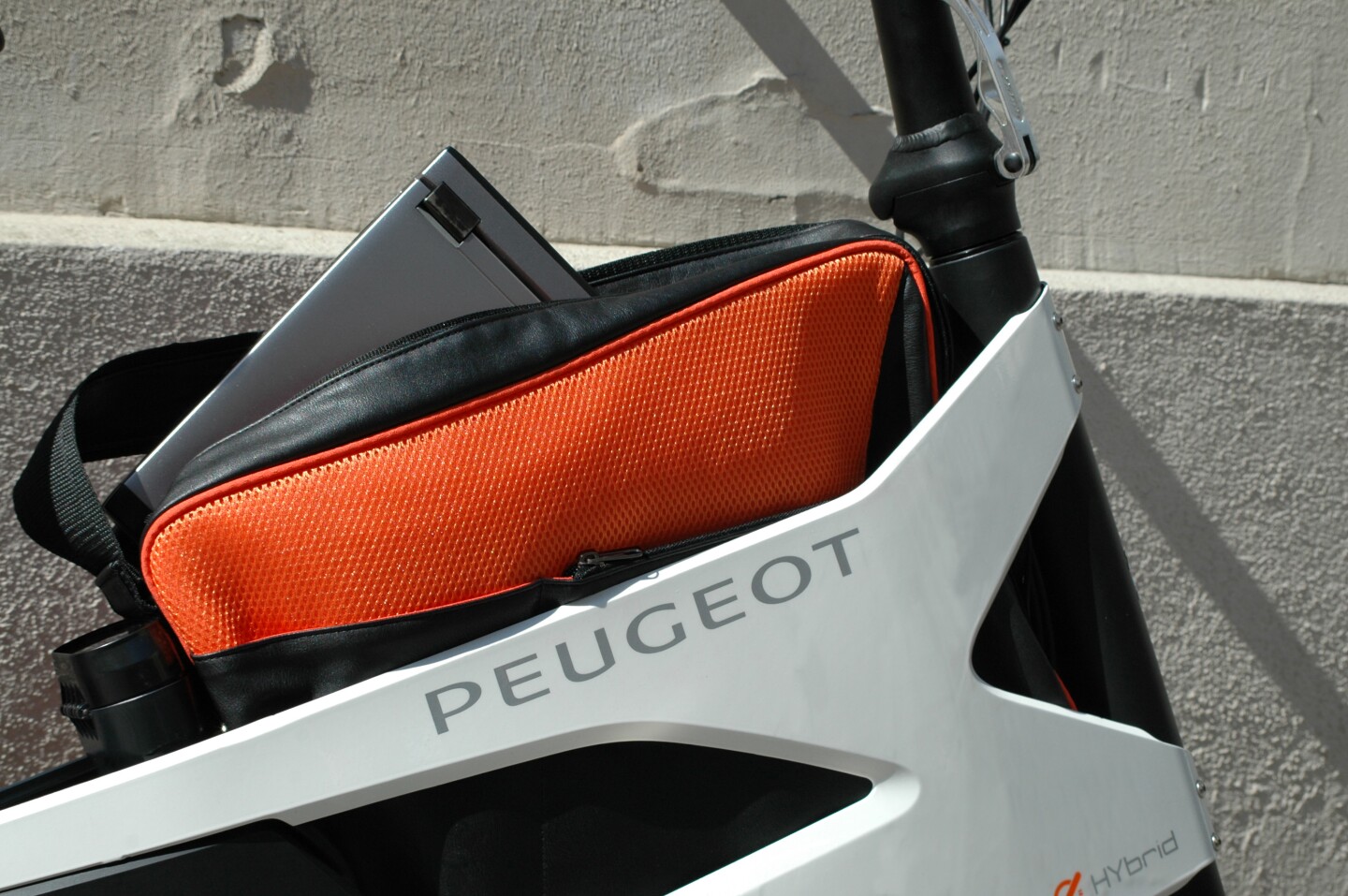 The frame of Peugeot's AE21 Hybrid electric bike has space for a laptop and ABUS Bordo folding lock