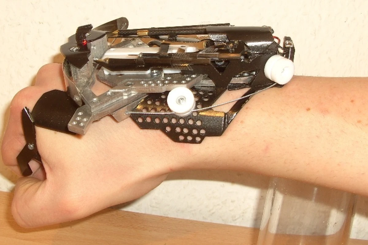 Hobbyist Patrick Priebe's latest creation is a wrist-mounted laser-sighted mini crossbow
