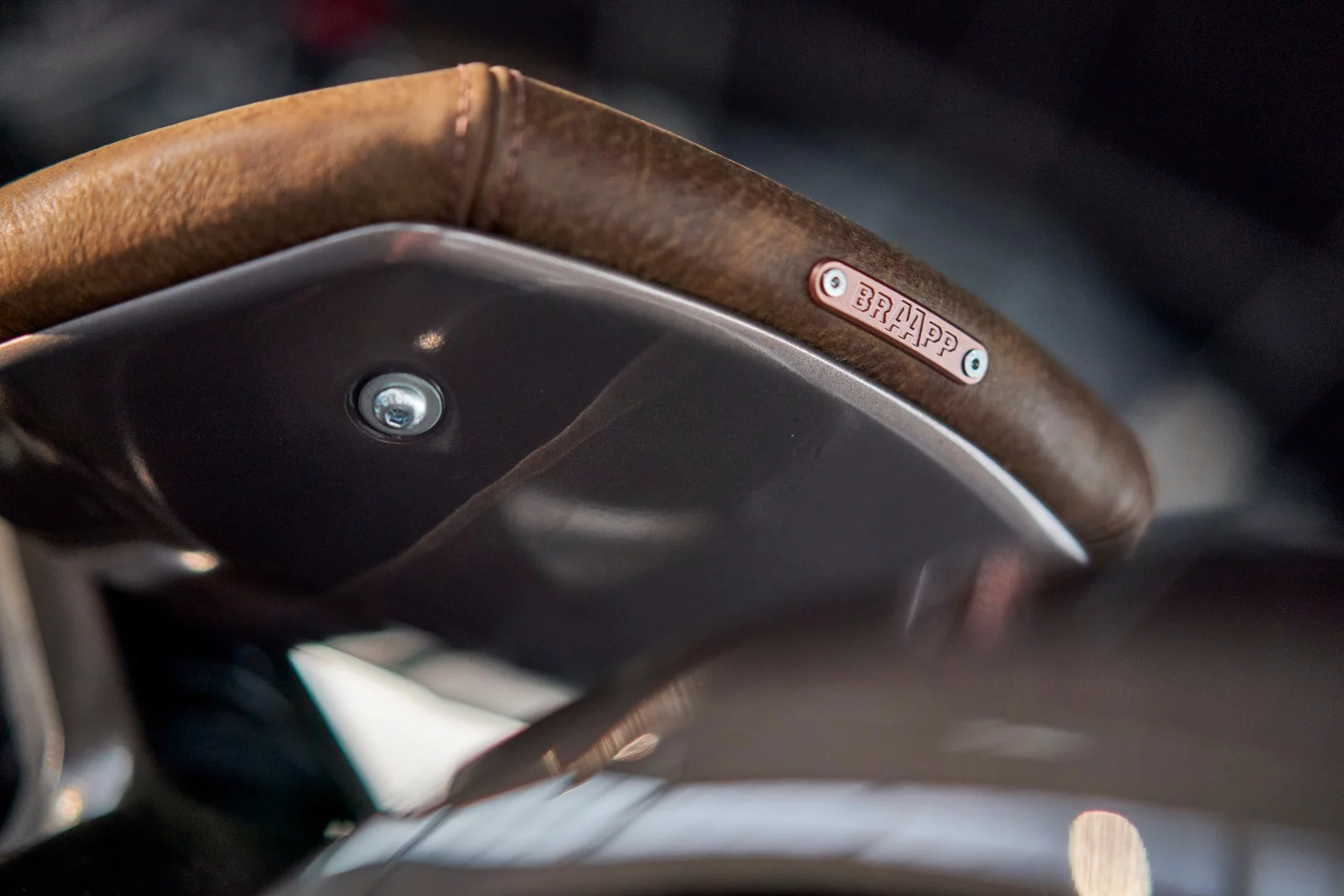 Royal Enfield Concept KX: leather-bound cantilevered seat unit says what we're all thinking