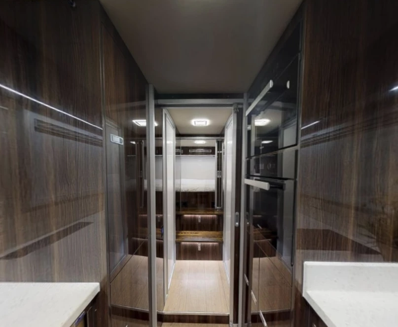 Looking back to the step-up rear bedroom from the kitchen