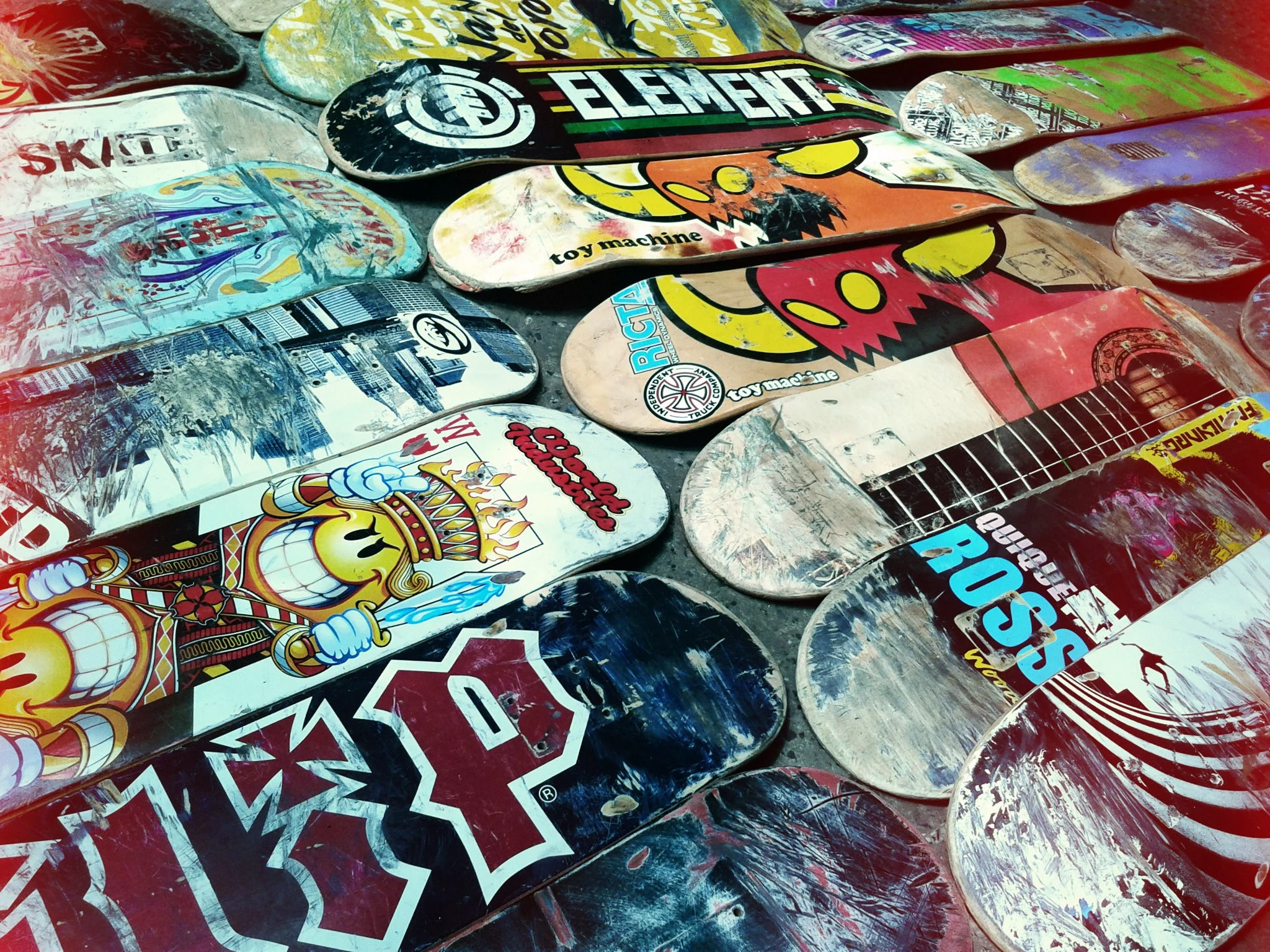 Some well-worn skateboards waiting to be transformed into a new Skate Guitar