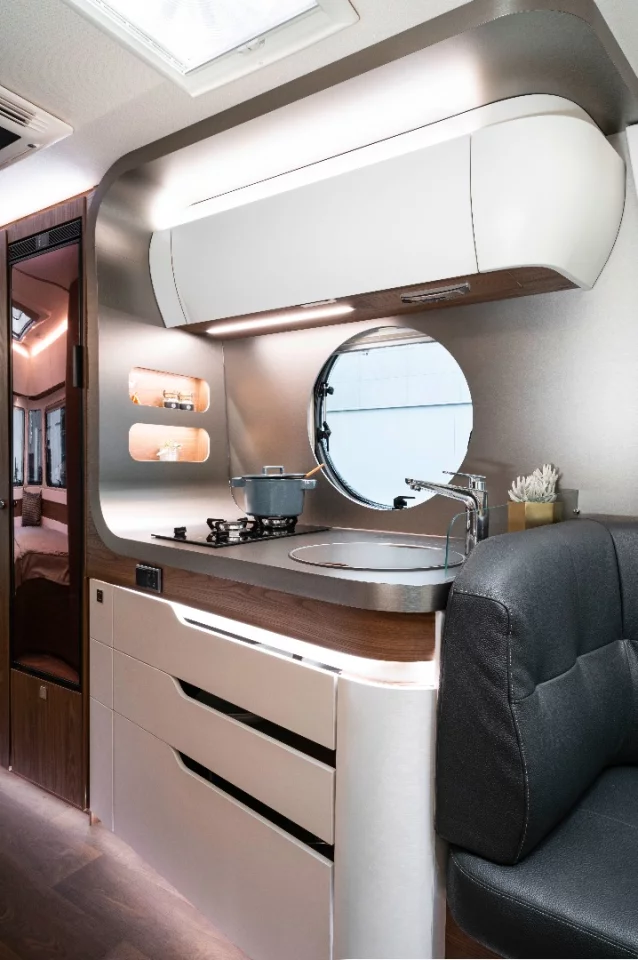 Eriba wraps the kitchen wall up and around to seal the kitchen area off from the rear of the trailer