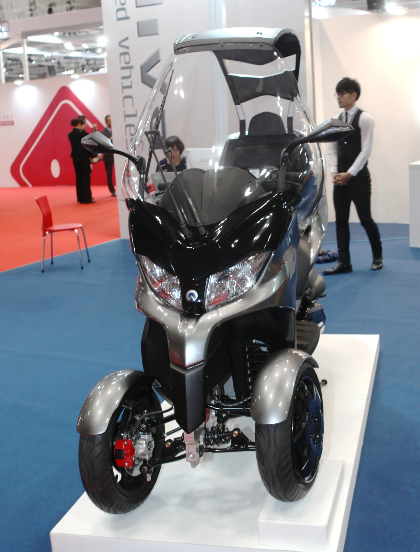 The Adiva AD3 three-wheeler (two front, one rear) scooter