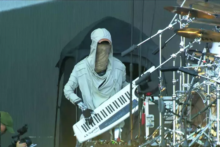 Adam rocking the keytar as part of Hu Yutong's performance at the VOYAGEX Music Festival in Changchun, China
