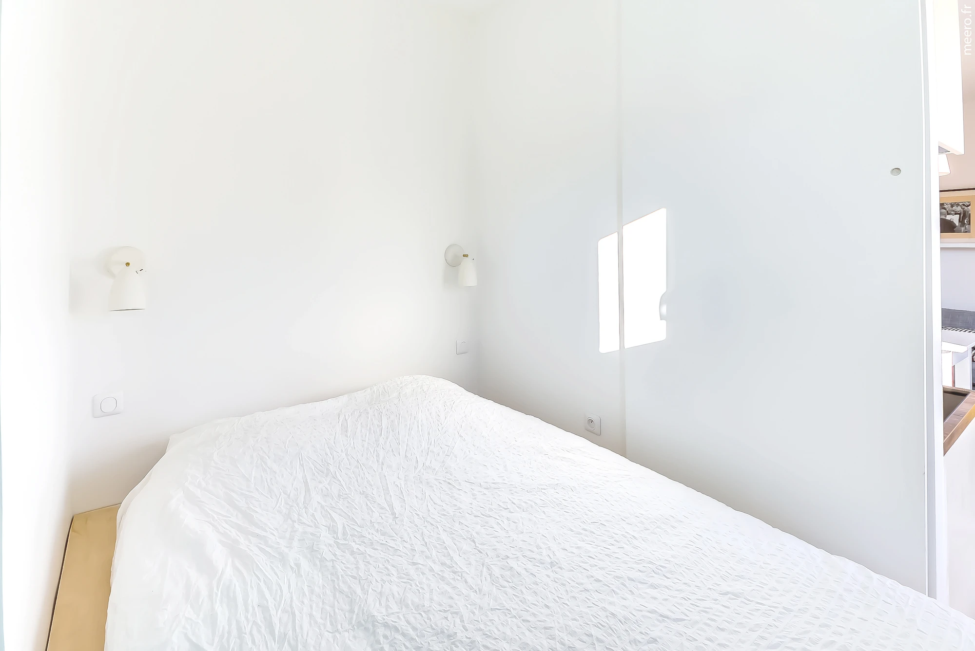 The bedroom area is quite novel and includes a bed that can be raised, Murphy bed style, to reveal a large storage space (Photo: Meero)