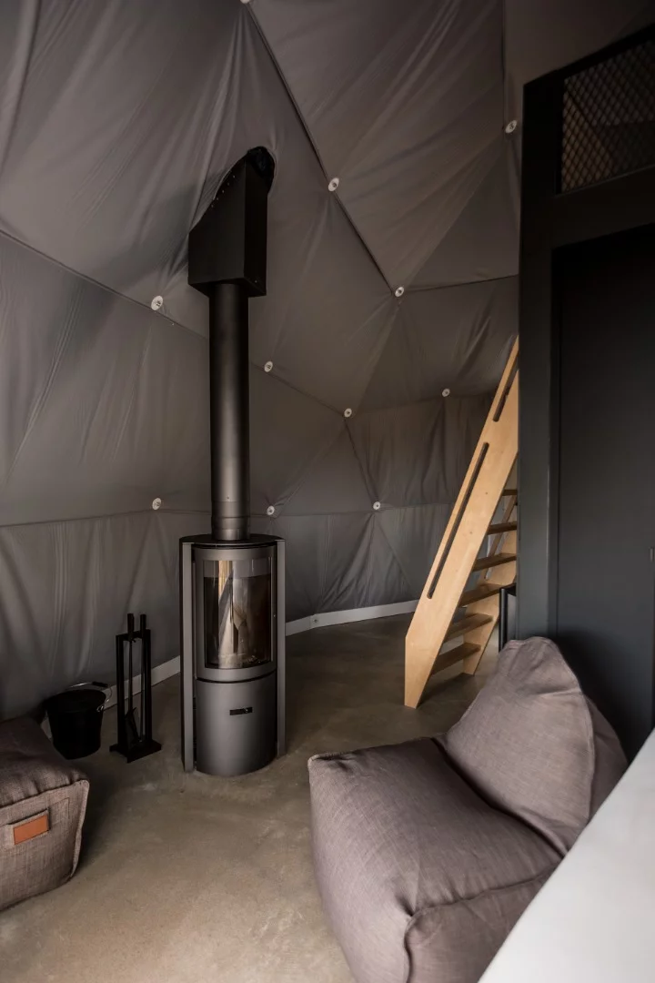 Each dome is eight meters (26.25 ft) in diameter and comes fully fitted with luxury furnishings, a wood fire and heated flooring