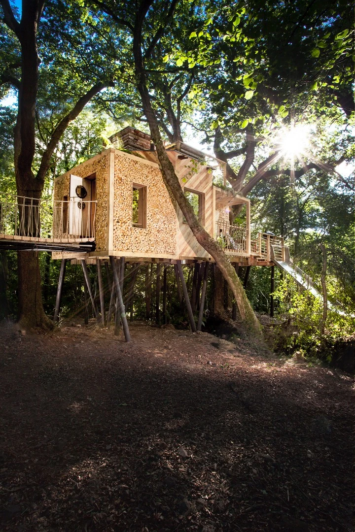 Woodsman's Treehouse features its own suspension bridge and slide