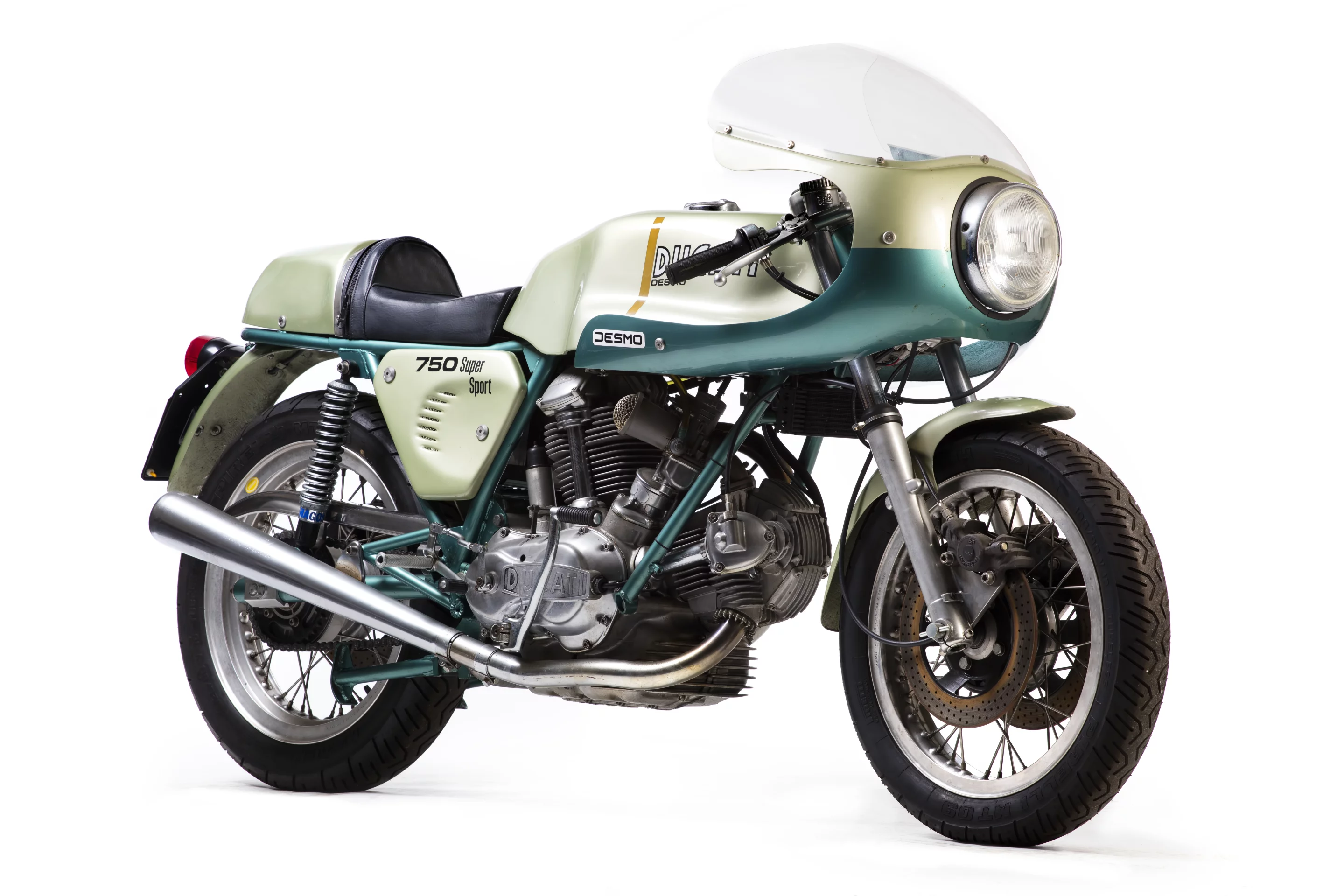 Slightly compromised in that it is not a matching numbers bike, the bike is regardless one of the original 401 examples of the green-framed 72 hp Desmo 750 SS which was produced to celebrate the Ducati 1-2 victory of Paul Smart and Bruno Spaggiari in the 1972 Imola 200 Mile race. That non-matching engine number cut $100,000 from the price, as a new world record for the 750 SS was achieved just a month ago when Gooding & Company sold a near identical 1974 Ducati 750 Supersport for $176,000, beating out the previous record of $152,885 (sold for €114,371) set at the Paris Retromobile auctions in February, 2013 by Artcurial. The bike (Lot 574) sold for £52,900 ($68,923).