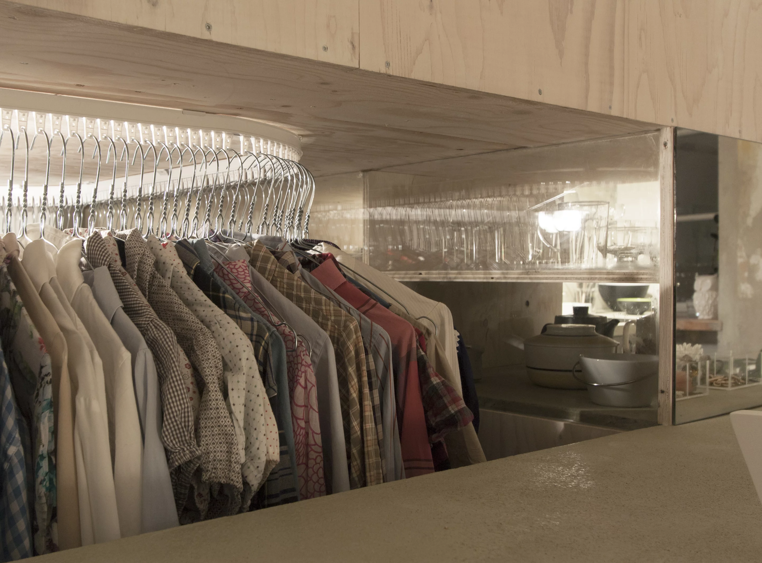 The clothes rack hides underneath the raised bed