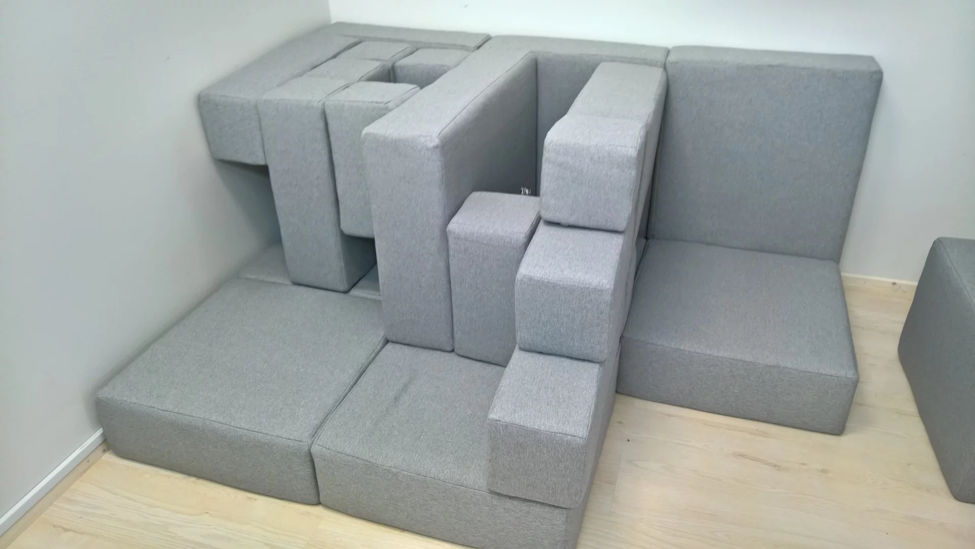 The series of upholstered sofa shapes and pieces gives the user the freedom to transform a sofa into a cushion fort