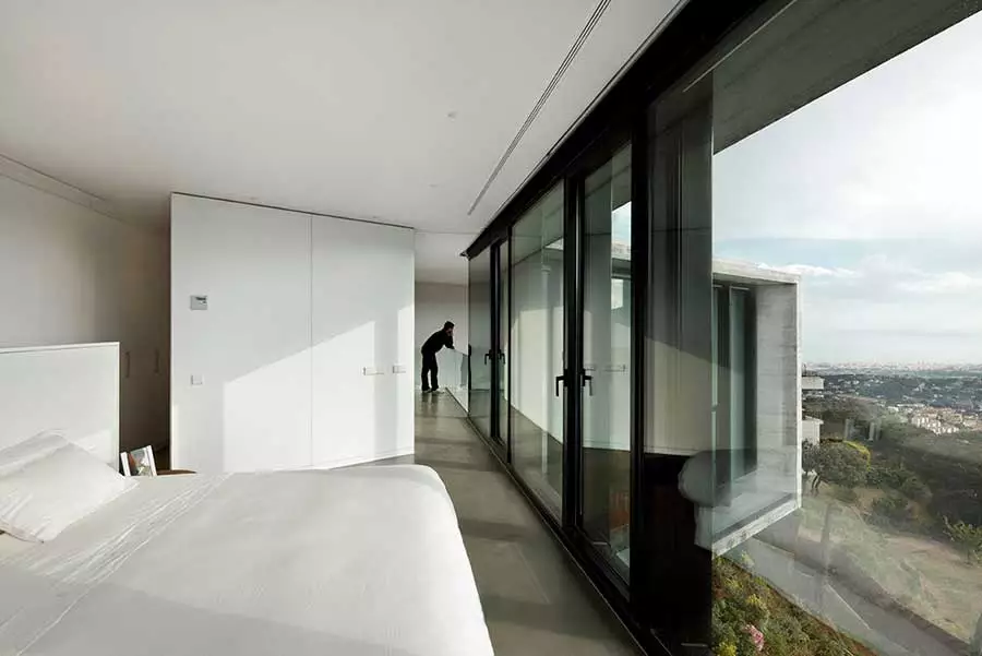 One of the bedrooms, complete with glass wall