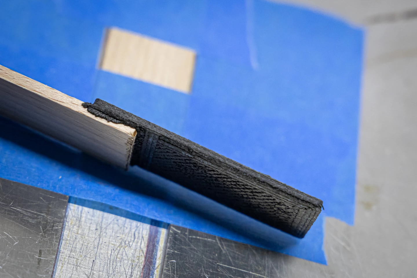 The "Addjoining" technique 3D prints a material like the plastic composite seen here straight into the pores of an untreated piece of lumber