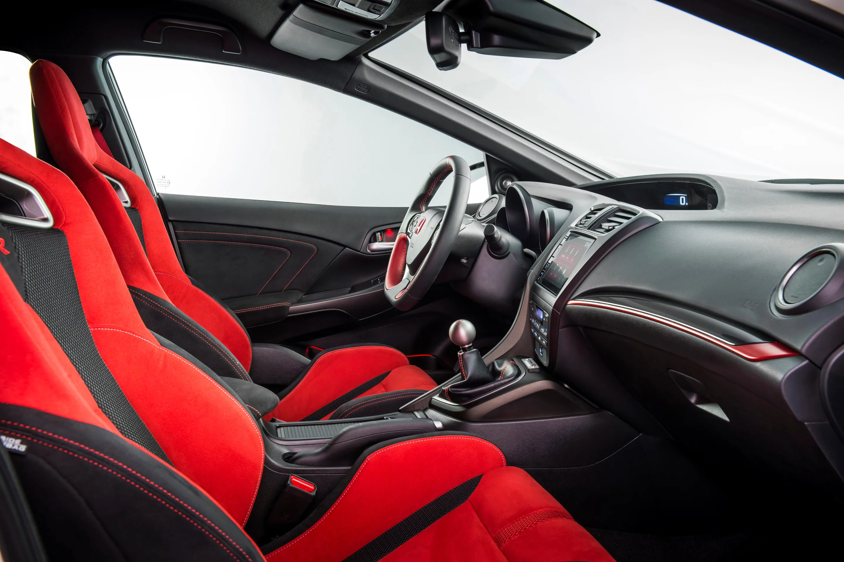 Sports seats with aggressive bolstering are part of the Type-R package