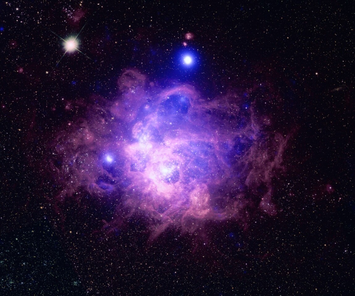 The massive star forming region NGC 604, located in the galaxy Messier 33 –Chandra data can be seen in blue while Hubble optical data is shown in purple