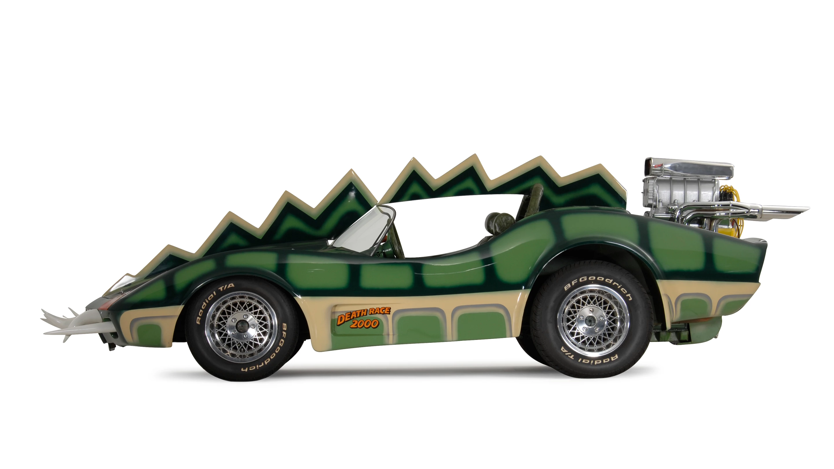 The car that is coming to auction is the Alligator Corvette driven by Carradine in Death Race 2000 (1975). The one-of-a-kind “alligator” Corvette (it's actually a Volkswagen chassis with an air-cooled Corvair motor), is expected to fetch between $20,000 and $25,000, despite the fact it got lots of screen time as Carradine (Frankenstein) fights against his deadly rival Stallone (Machine Gun Joe).