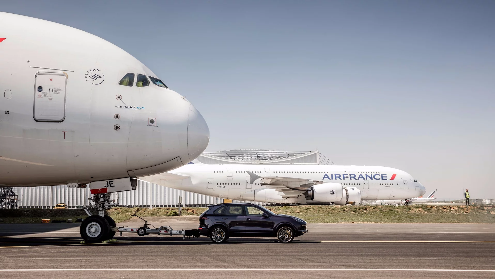 An Air France A380 being pulled by a Porsche Cayenne S Diesel