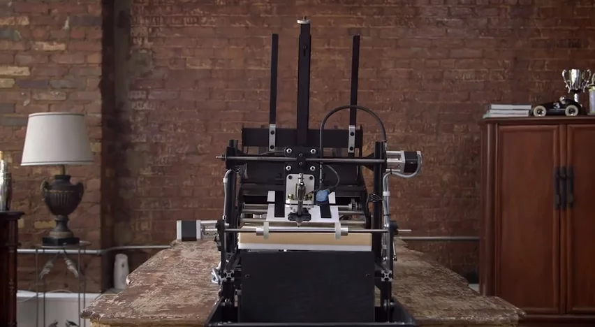 The Bond robot creates a "hand-written" note in your handwriting