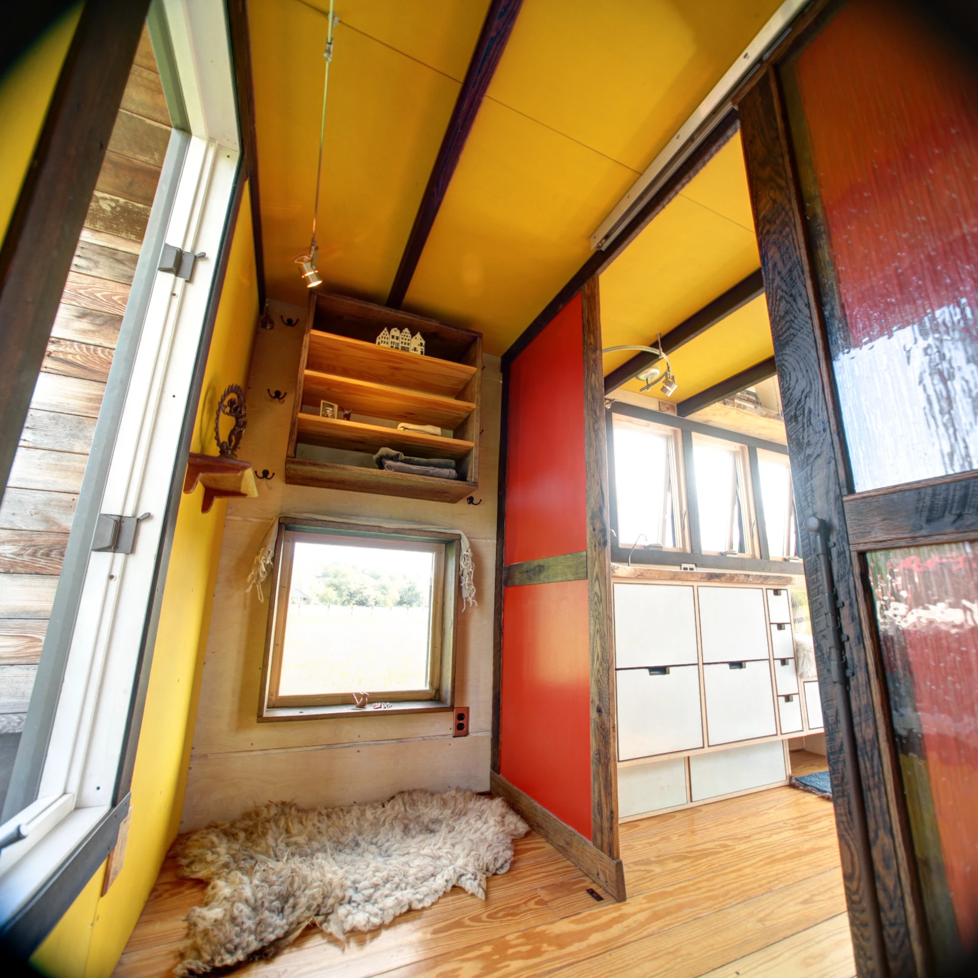 Pocket Shelter features a sliding glass pass-through door and a bathroom with a mini built-in composting toilet