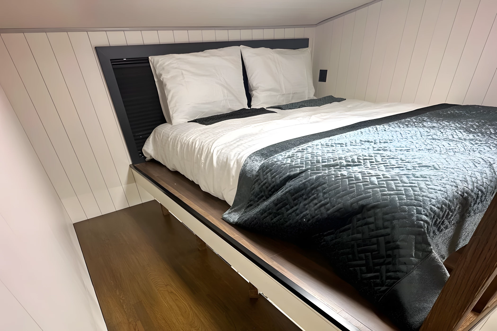 The Miami tiny house includes two bedrooms, both of which are typical loft models with low ceilings and double beds