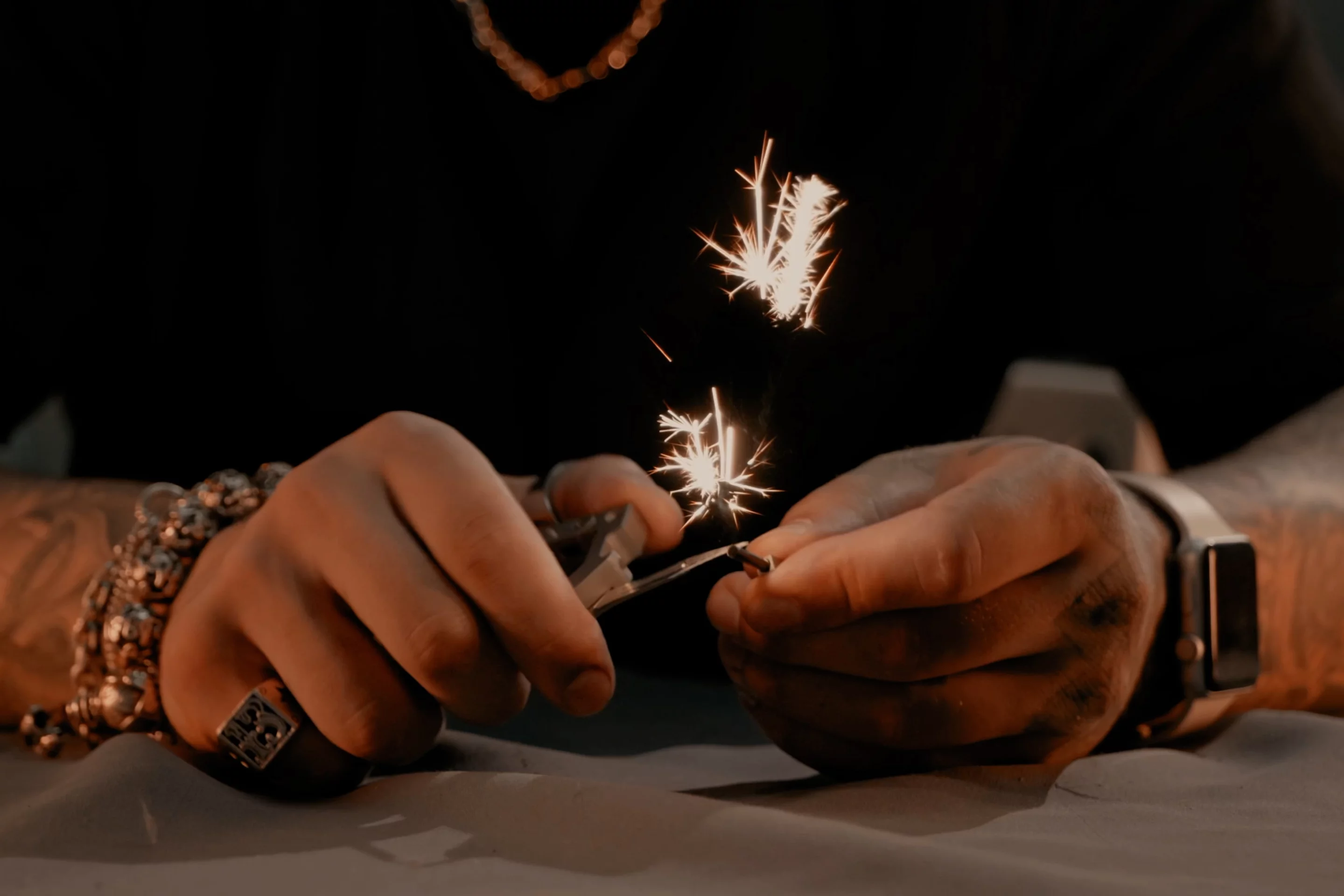 The GH Carabiner's fire-starter in action