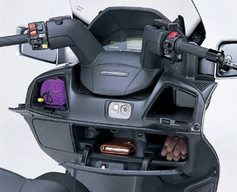 The Burgman also has the feel of a luxury car in that it is extremely well appointed there's a light in the storage compartment which switches on automatically when you lift the seat, illuminating the entire area, reminiscent of BMW-style thoroughness. The front fairing contains three compartments which became incredibly useful having a glove box on a motorcycle is far more useful than in a car!