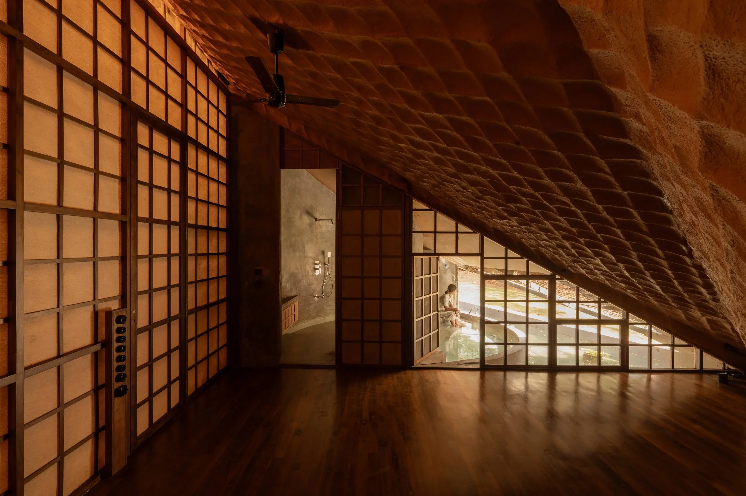 Partitioned shower/bathing room opens to the outside