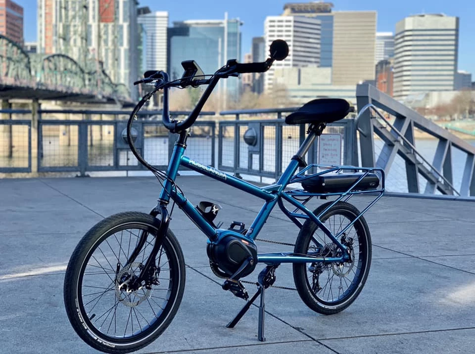 The Roselandia features a Bafang drivetrain and a battery pack mounted under the cargo rack