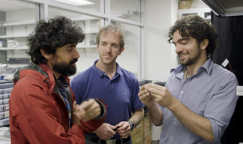Stanford Assistant Professor Manu Prakash, left, and graduate students Jim Cybulski and Georgios Katsikis developed the water drop computer