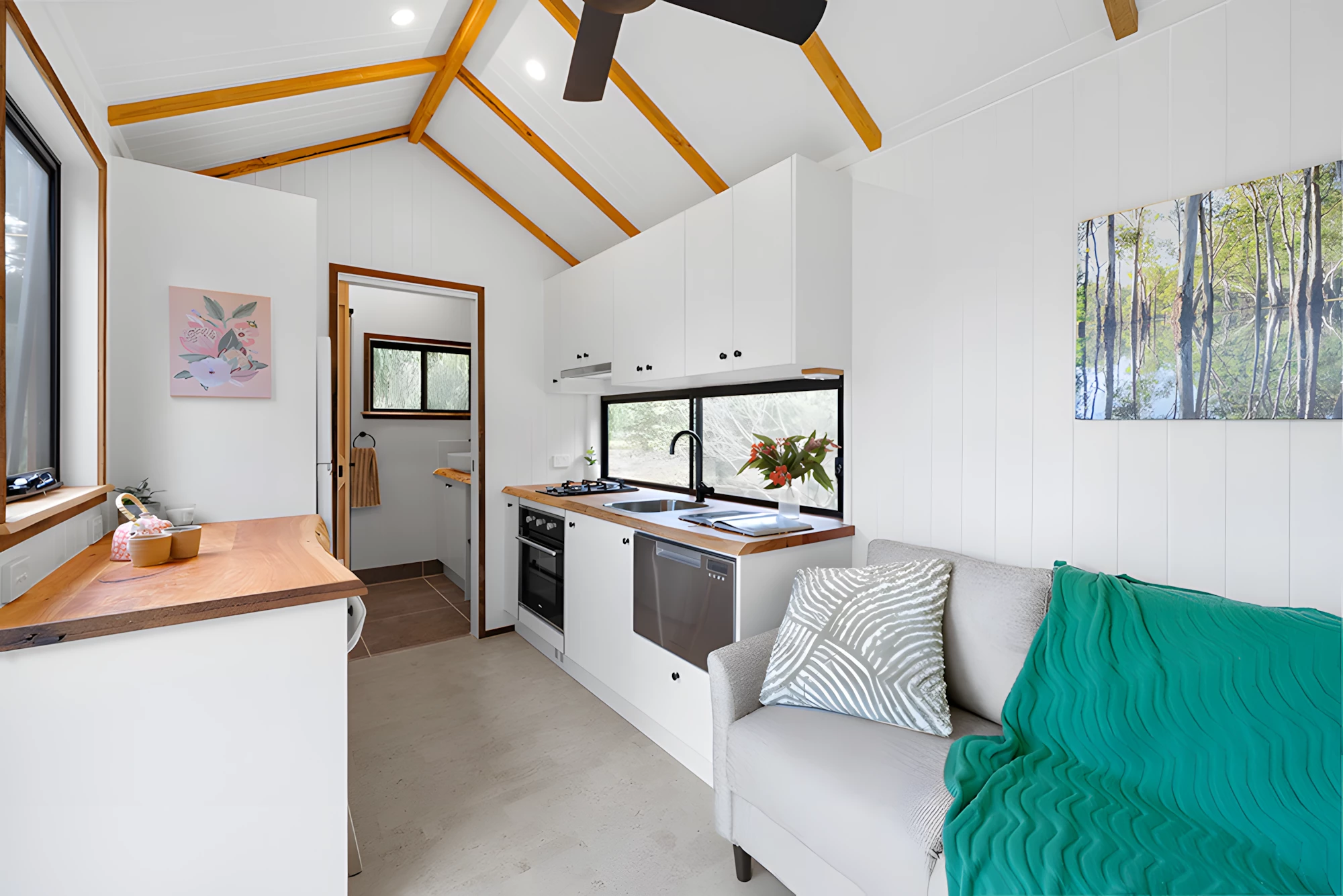 The Casuarina's kitchen boasts a dishwasher, which is a rare luxury in a tiny house