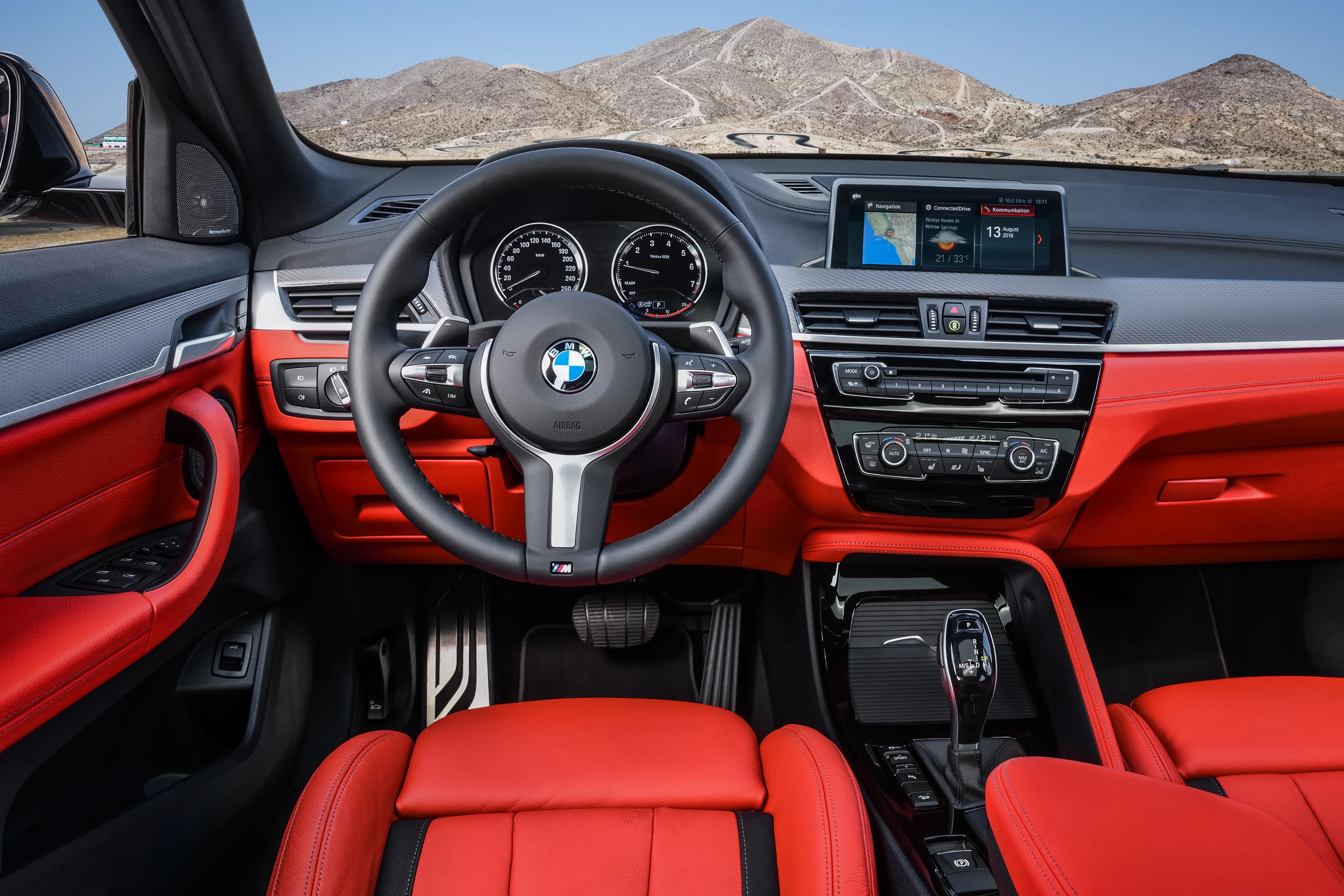 Inside the M35i's cabin there’s an M Sport leather steering wheel with shift paddles and BMW’s iDrive display alongside it