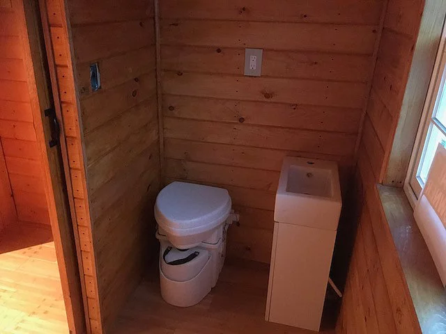 The Devasa's bathroom includes a composting toilet and sink