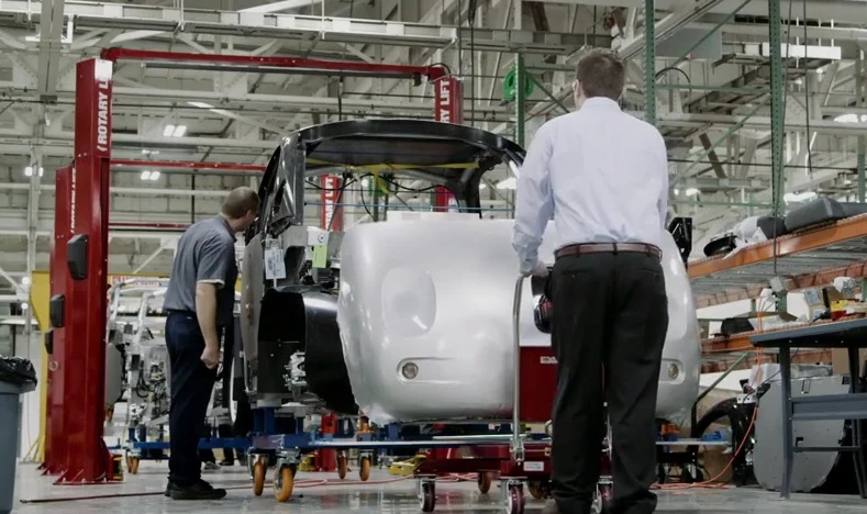 The car features crash protection for both its occupants and pedestrians, including a foam exterior and flexible windshield