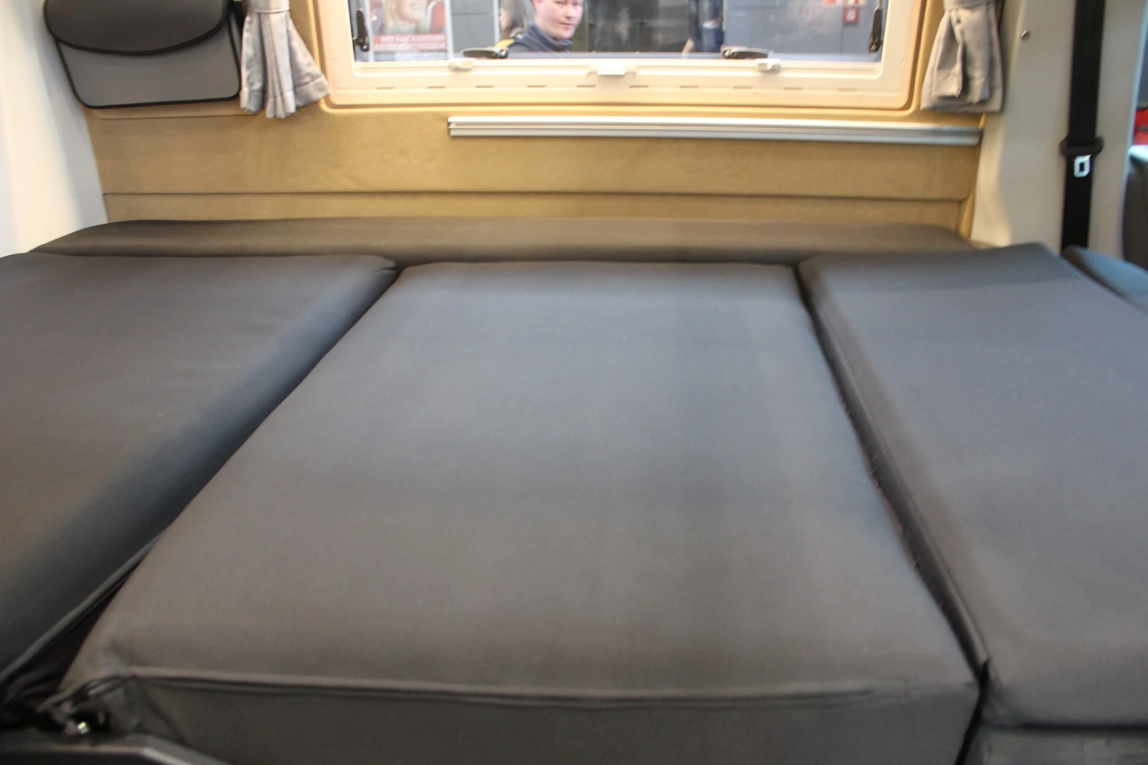 Fold it flat, and the central bench becomes the double bed
