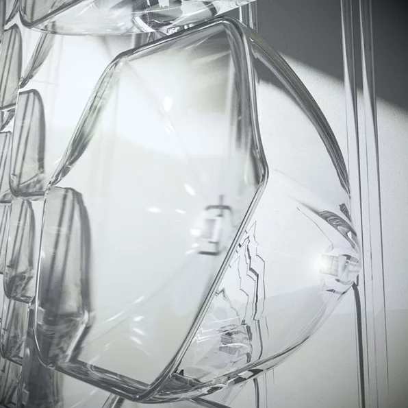 The concentrator cell uses a lens to focus incoming light onto the solar cell