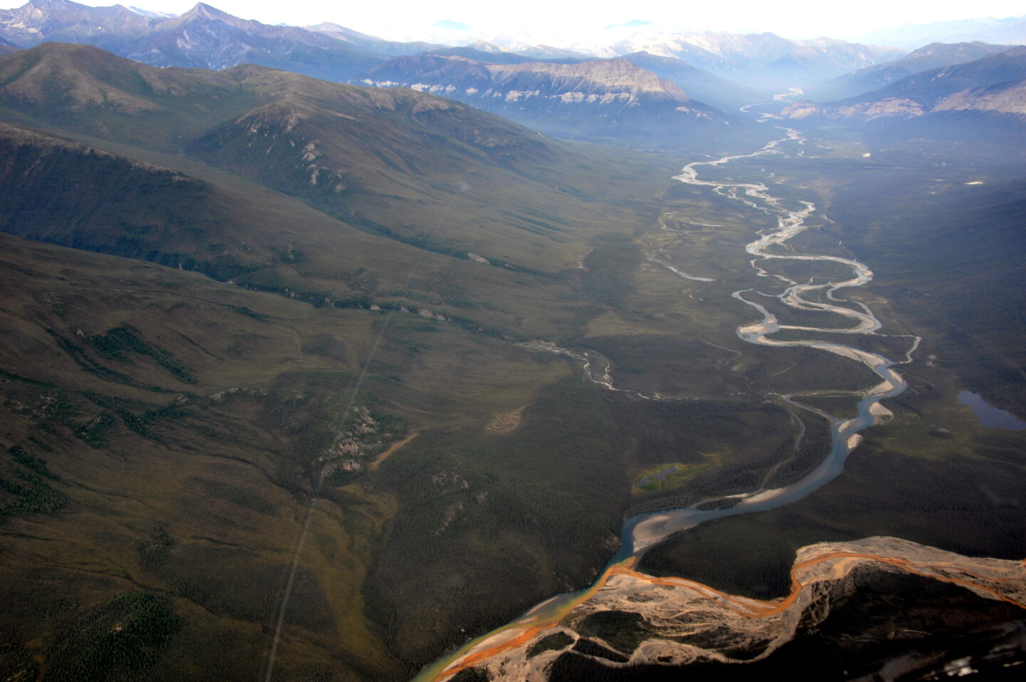 An aerial view of the Kutuk River in Alaska’s Gates of the Arctic National Park, where a portion of the water is rust-stained