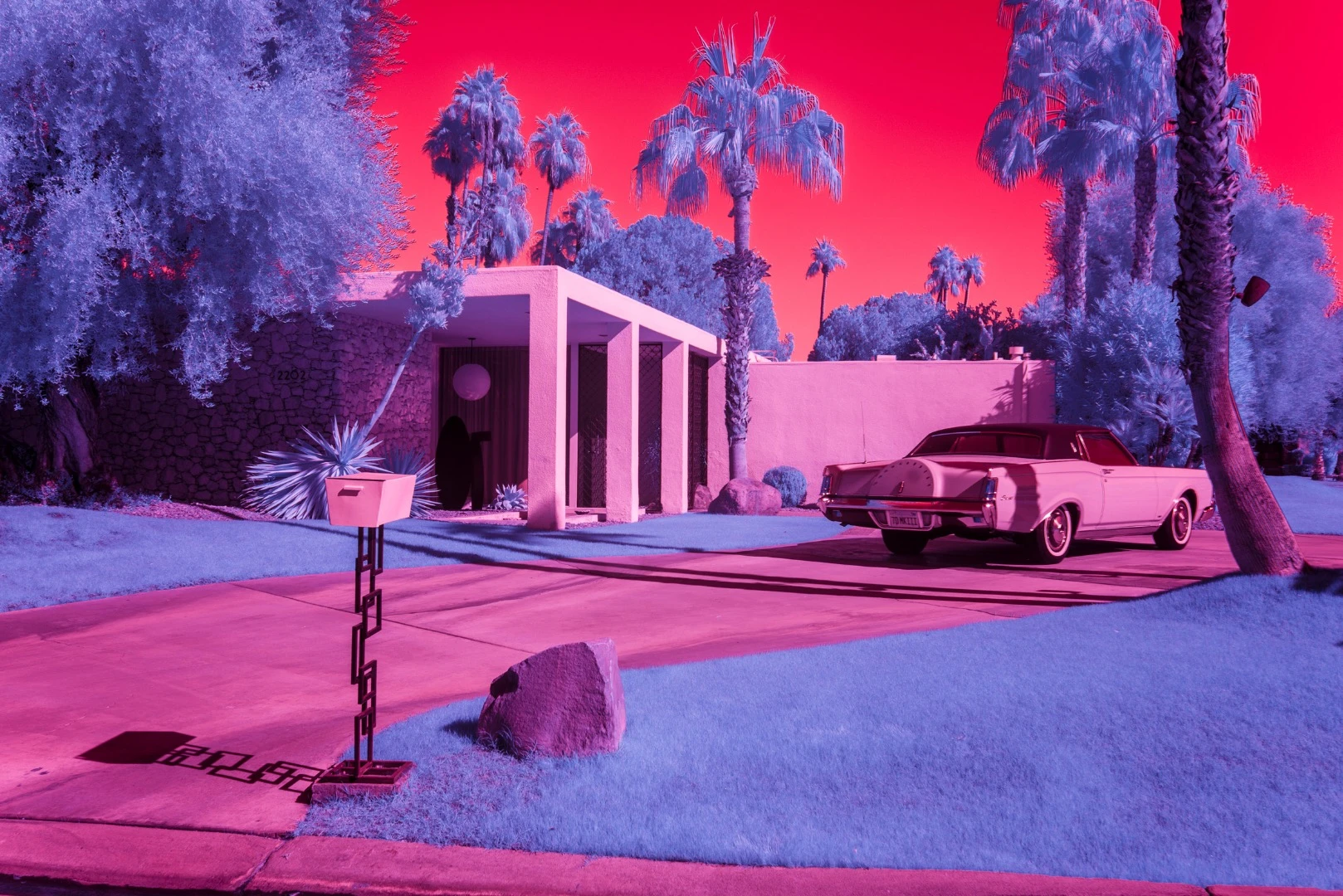 Kate Ballis’ series Infra Realism is an extreme, stylized take on the style contrasting images of classic mid-century Palm Springs architecture with jarringly sharp and disorientating infrared purples and reds
