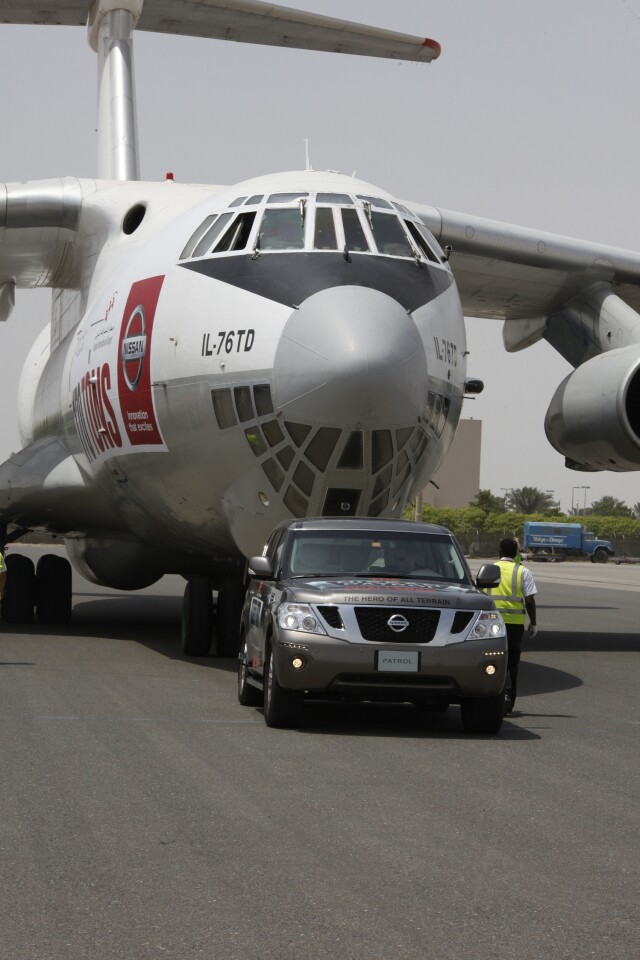 The Nissan Patrol towing the 170.9-ton cargo plane to claim the "heaviest object pulled by any production vehicle" Guinness World Record