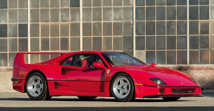 In 1986, Porsche claimed the title of the world's fastest road car when it introduced the 959 which could achieve 197 mph. Ferrari's answer was this car, the F40, which was developed from the 288 GTO Evoluzione. Using advanced aerodynamics and a 478 bhp, 2,936 cc DOHC twin-turbocharged V-8 engine with Weber-Marelli fuel injection, the F40 was the first production car to break the 200 mph barrier, achieving a top speed of 201.4 mph. This particular example, highlighted by its low mileage, Classiche certification, and impeccable condition, was sold by RM Auctions for US$1,265,000. Photos: Robin Adams ©2015