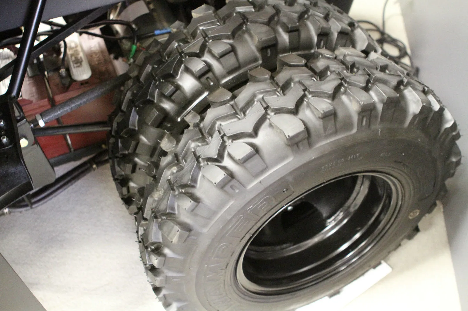 Custom-made dual 28 inch Super Swamper tires shod the back to manage sand traps and water hazards