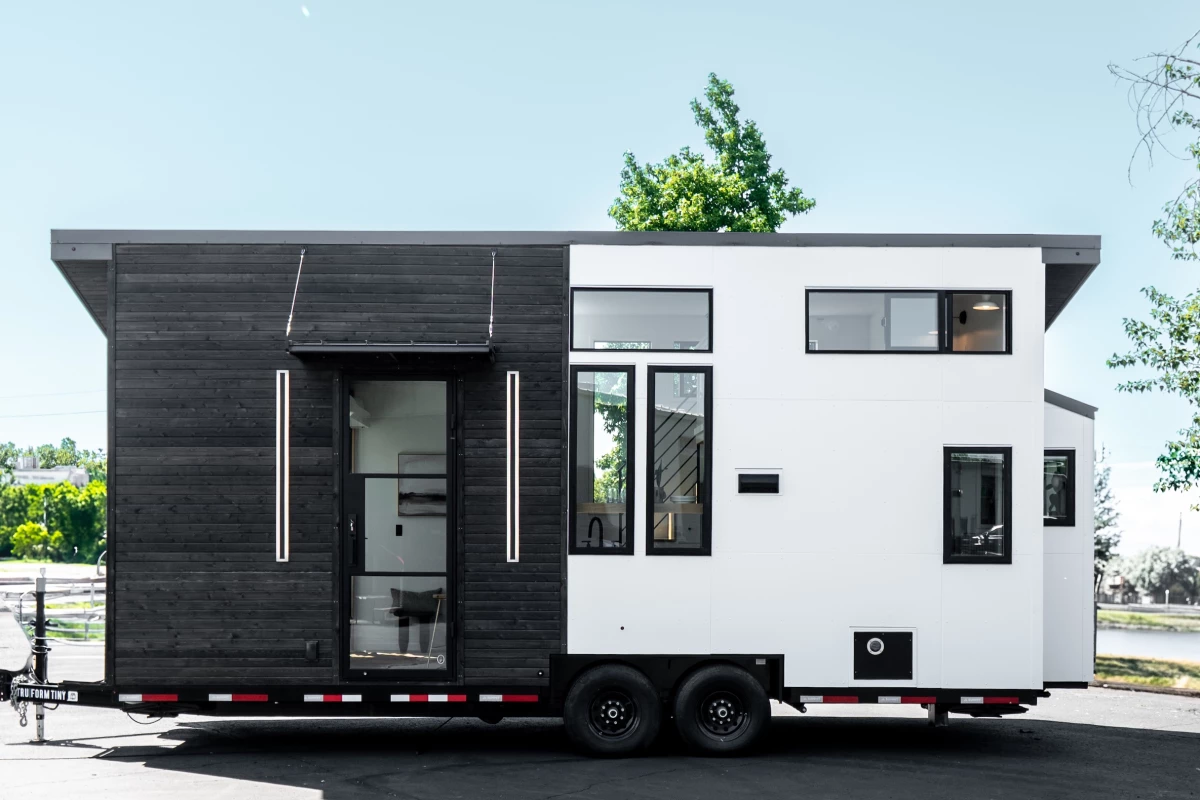 The Terra Urban is a modern tiny house that maximizes floorspace with an elevating bed