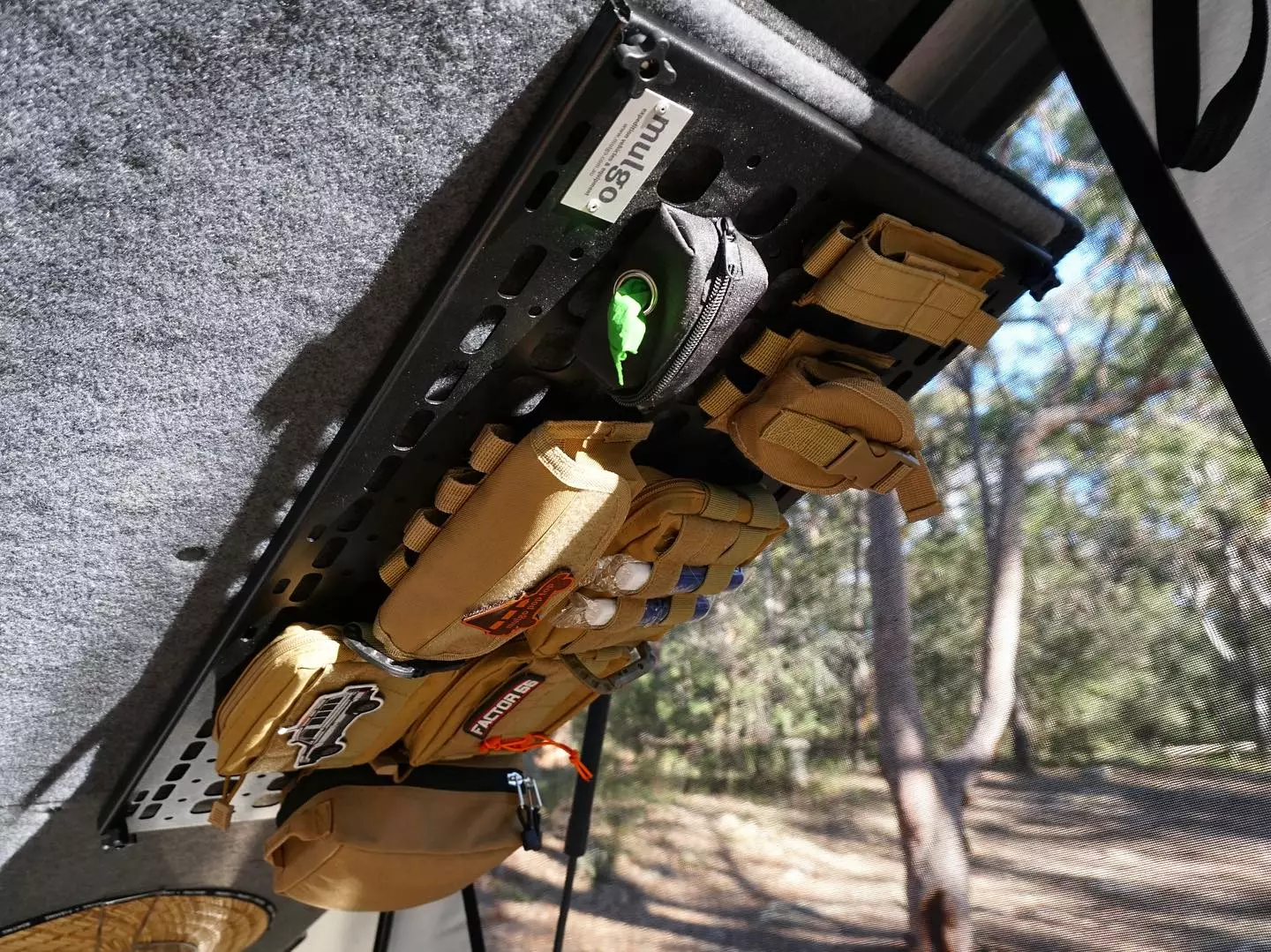 Available MOLLE panels on the underside of the bed provide interior organization