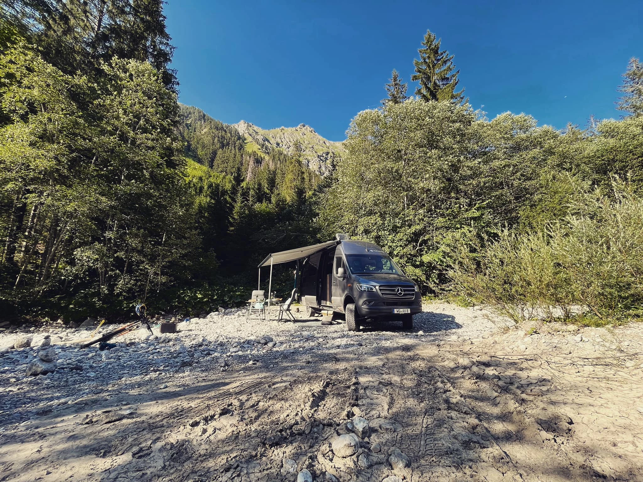 The Alphavan 4x4 leaves its tracks in the dirt and silt on the way to a cozy backcountry campsite