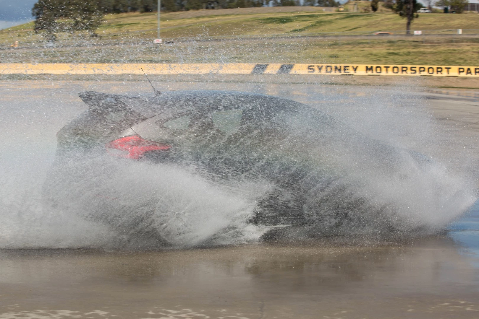 The Focus RS cuts through the splash at the Sydney Motorsports Park