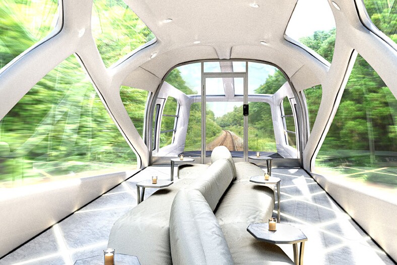 The rear lounge car is decked out with a central island-style sofa and dotted with small coffee tables