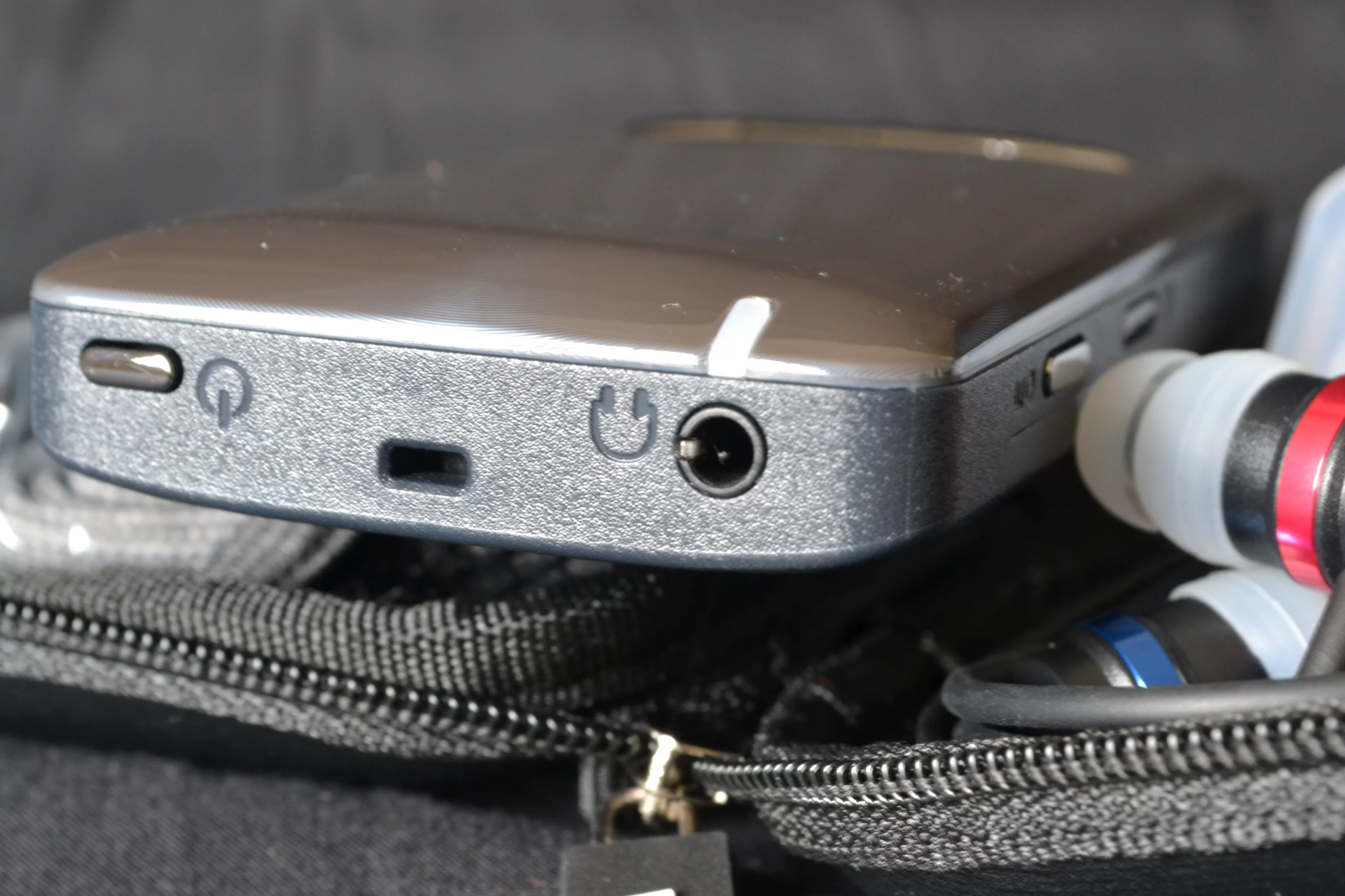 There's a power switch, neck loop hook and headphone jack to the top