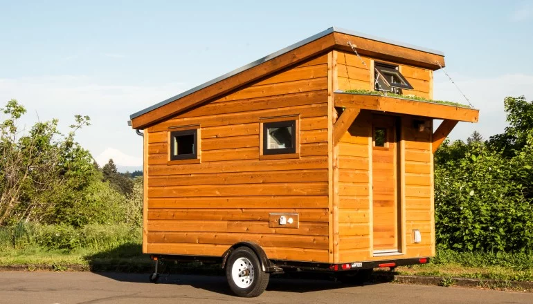 The Salsa Box boasts a queen-sized bed, a flushing toilet, an electric hot water heater, a combined shower and mini-tub, and a basic kitchenette (Photo: Shelter Wise)