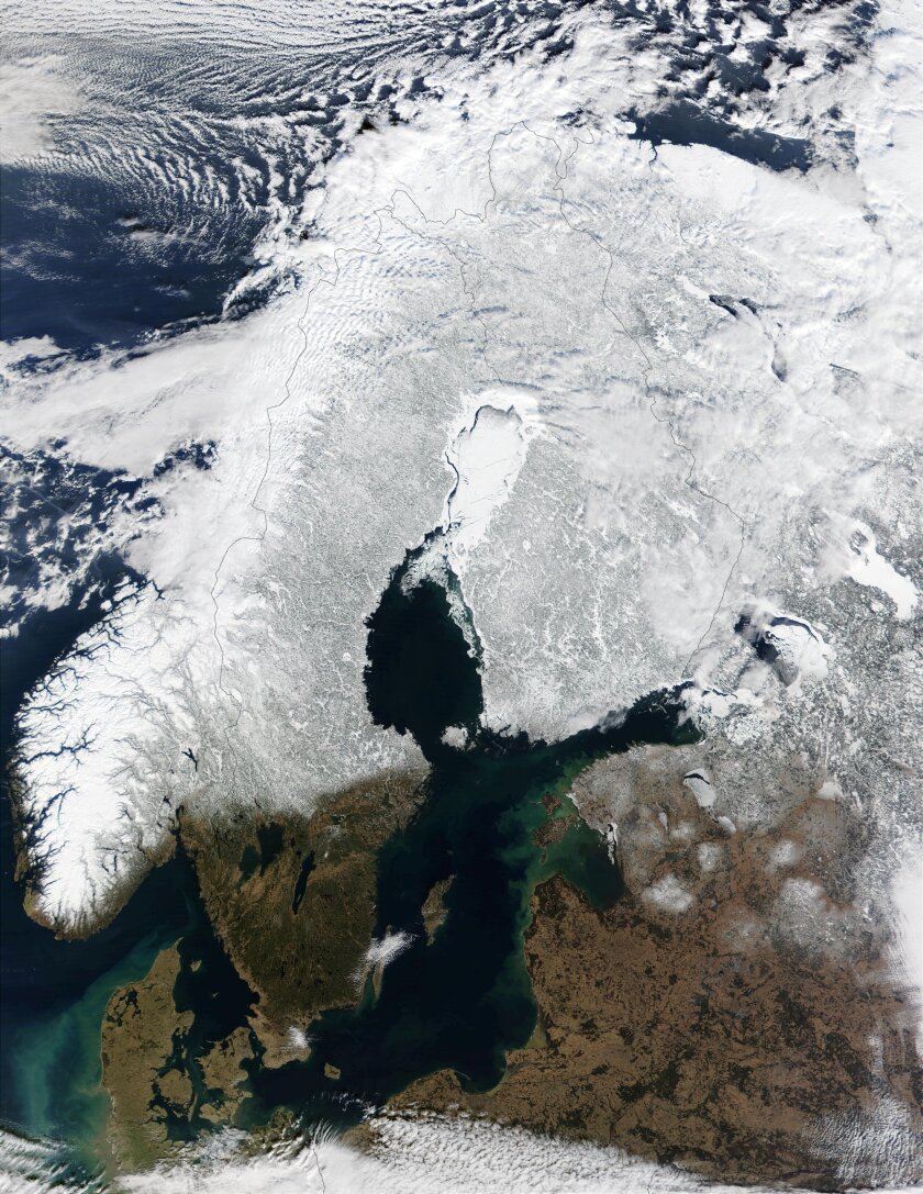A satellite photo showing Scandinavia and northern Russia, and the encroachment of sea ice during winter (Image: Jacques Descloitres, MODIS Land Rapid Response Team at NASA GSFC)